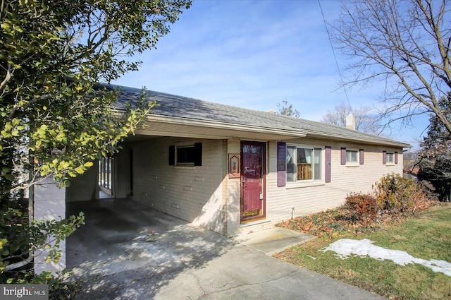 ranch-style house with a carport