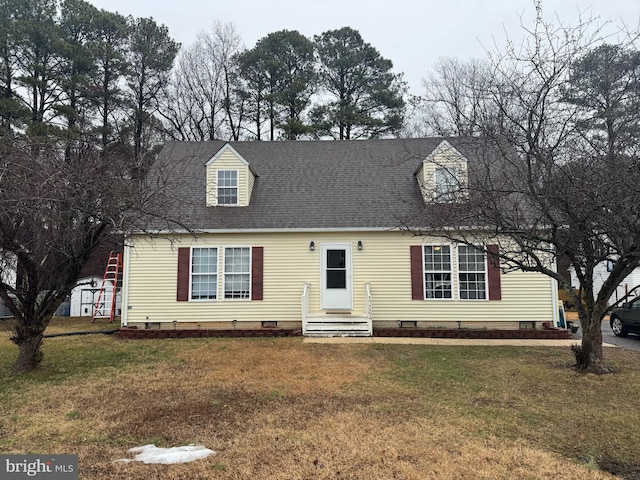 new england style home featuring a front lawn