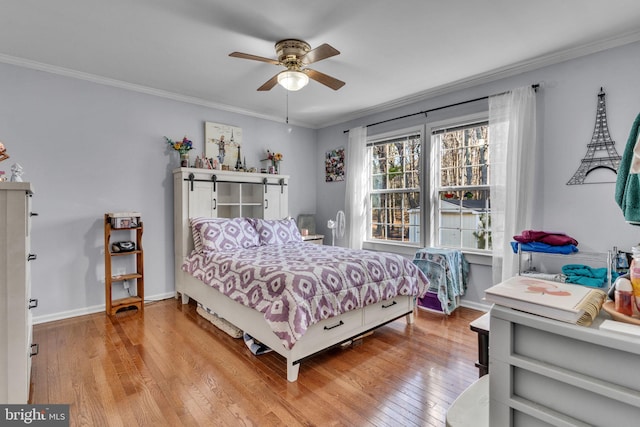 bedroom featuring ornamental molding, ceiling fan, and light hardwood / wood-style floors