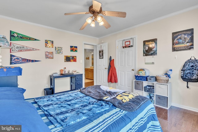 bedroom with ceiling fan, ornamental molding, and dark hardwood / wood-style flooring