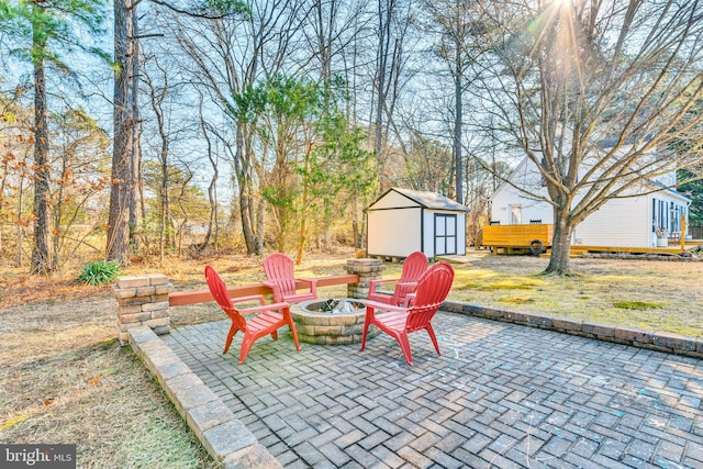 view of patio / terrace featuring a storage unit and an outdoor fire pit