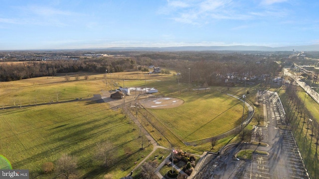 birds eye view of property with a rural view