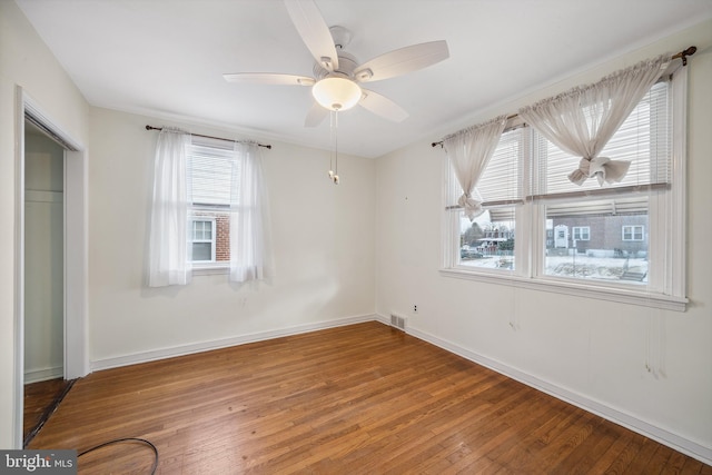 unfurnished bedroom with wood-type flooring and ceiling fan