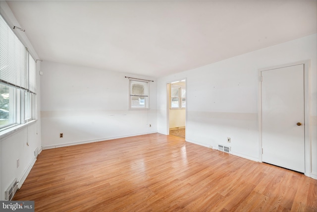 spare room featuring light hardwood / wood-style floors