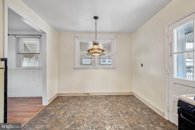 unfurnished dining area featuring dark wood-type flooring