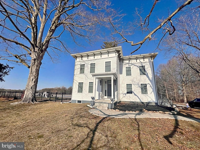 view of front facade with fence and a front lawn