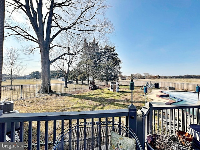 view of yard featuring a patio area, a fenced backyard, and a fenced in pool