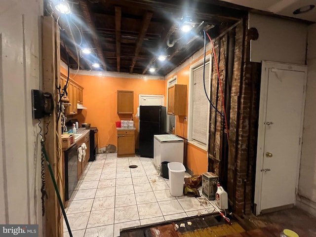 interior space featuring black fridge and light tile patterned floors