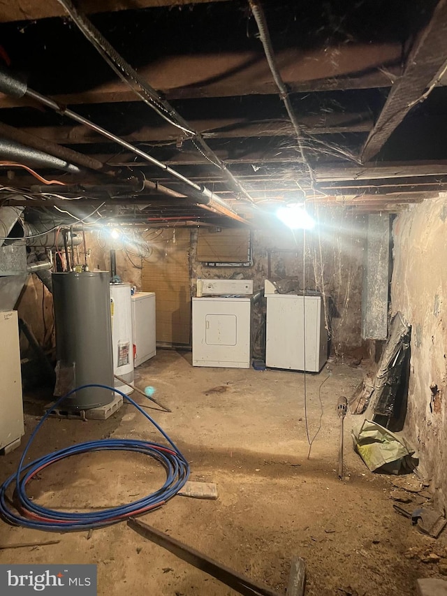 basement with gas water heater and washing machine and clothes dryer