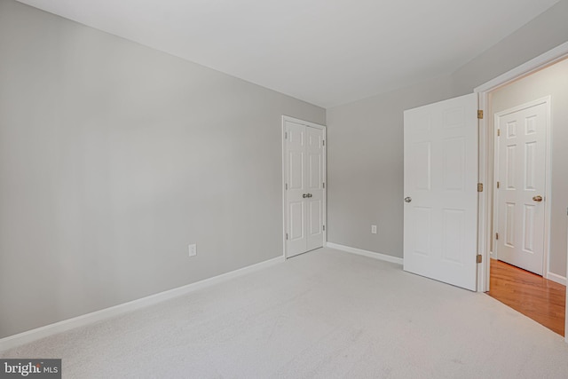 unfurnished bedroom with light carpet