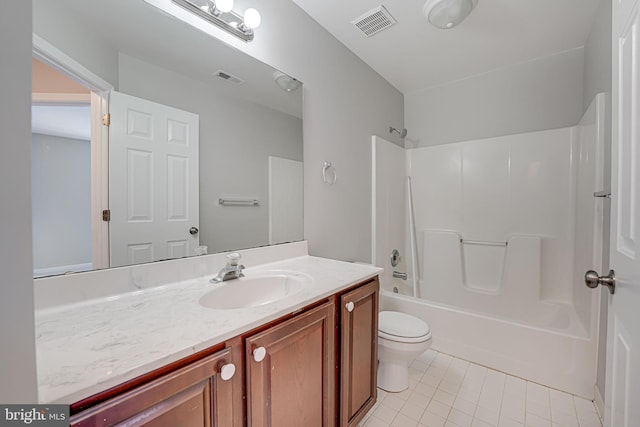 full bathroom with vanity, toilet,  shower combination, and tile patterned flooring