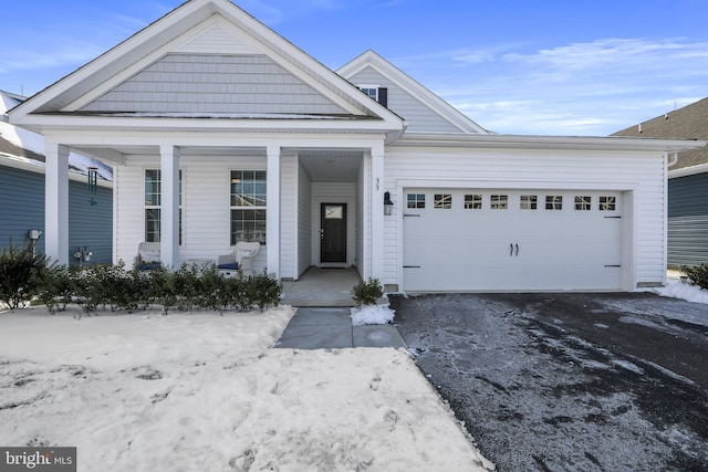 view of front of home with a garage and covered porch