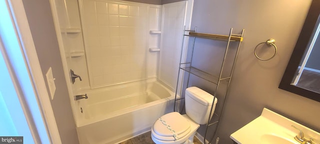 full bathroom featuring washtub / shower combination, toilet, and sink