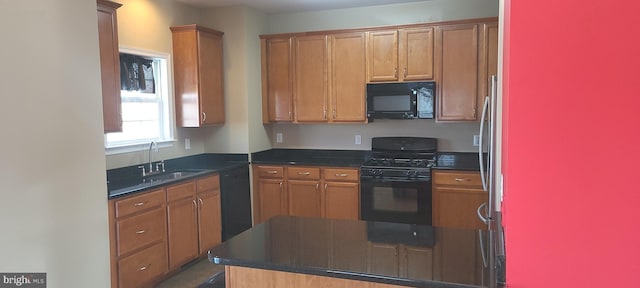 kitchen featuring sink and black appliances