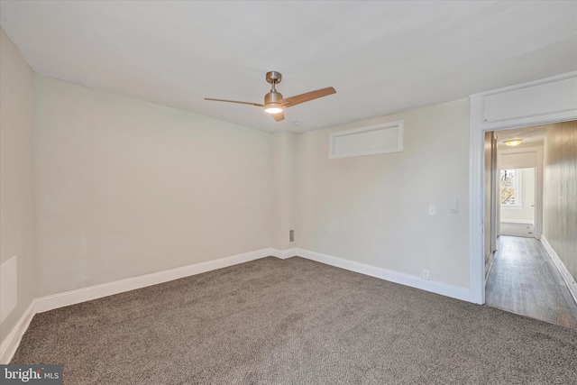 carpeted empty room featuring ceiling fan