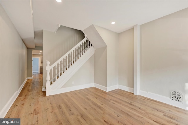 stairway featuring hardwood / wood-style flooring