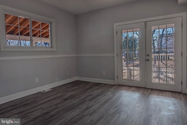 interior space with french doors and dark hardwood / wood-style floors