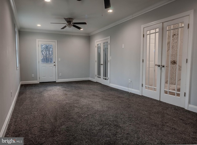 carpeted empty room with crown molding, ceiling fan, and french doors