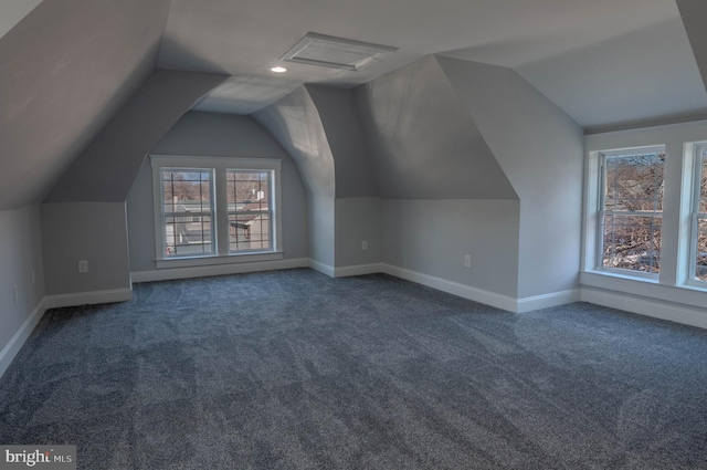 bonus room featuring vaulted ceiling and carpet floors