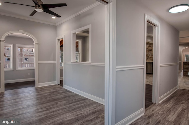 hall with ornamental molding and dark hardwood / wood-style floors