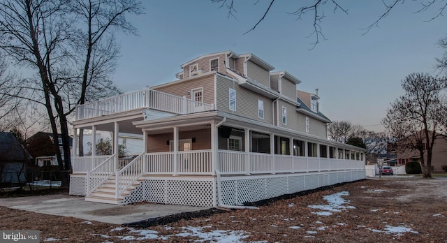 view of front of home with a sunroom