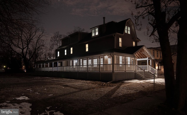 view of back house at night