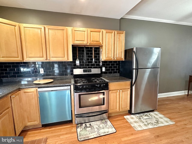 kitchen with decorative backsplash, stainless steel appliances, light hardwood / wood-style floors, and light brown cabinets