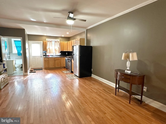 kitchen featuring sink, ceiling fan, backsplash, stainless steel appliances, and light hardwood / wood-style floors