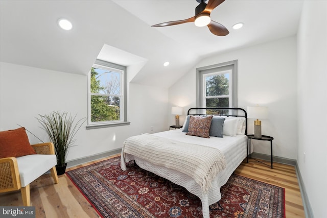 bedroom with lofted ceiling, wood-type flooring, and ceiling fan