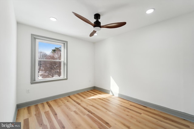 unfurnished room featuring hardwood / wood-style floors and ceiling fan