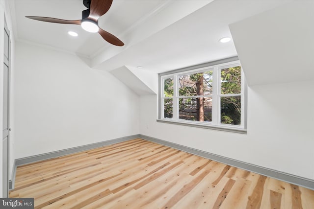 bonus room with hardwood / wood-style flooring and ceiling fan