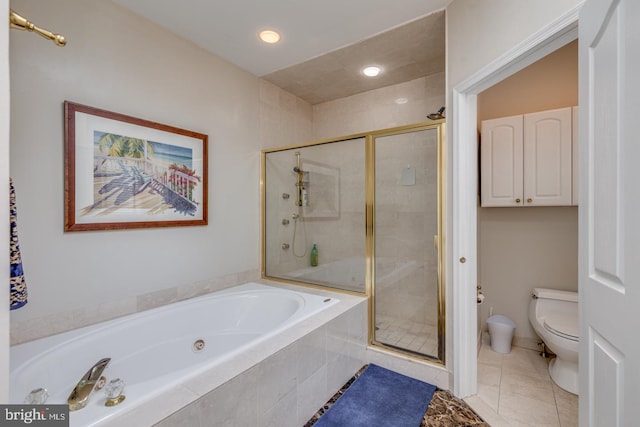 bathroom featuring tile patterned flooring, shower with separate bathtub, and toilet