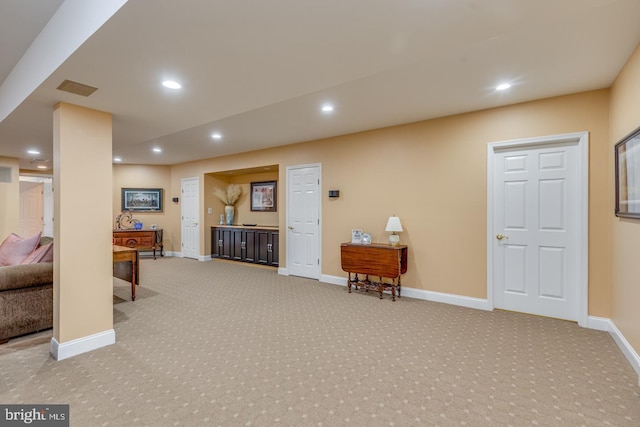 interior space featuring light carpet