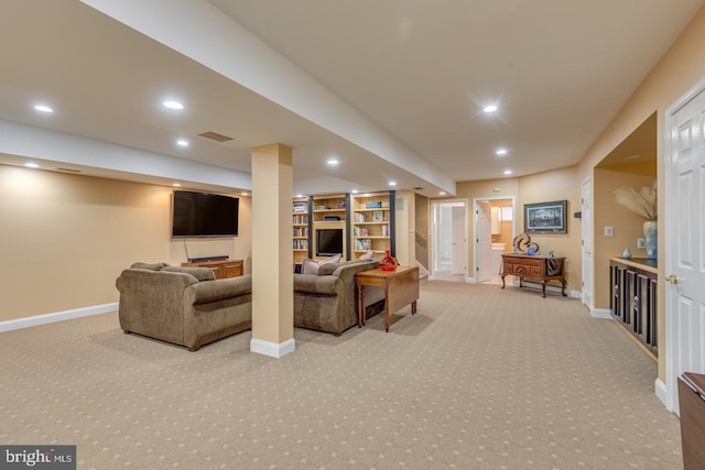 living room with light carpet and built in shelves