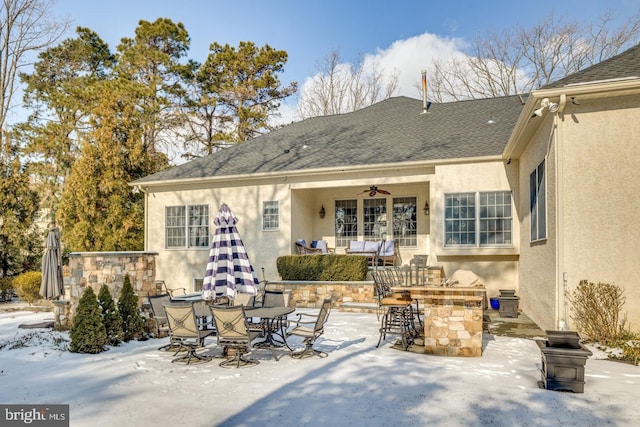 snow covered property featuring a patio area, an outdoor bar, and ceiling fan