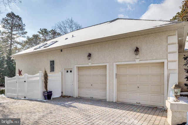 view of side of home featuring a garage