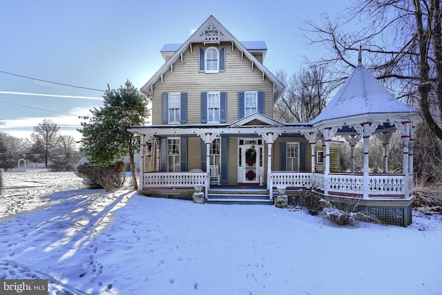 victorian-style house featuring a porch