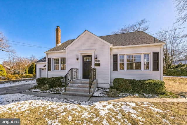 bungalow featuring a garage