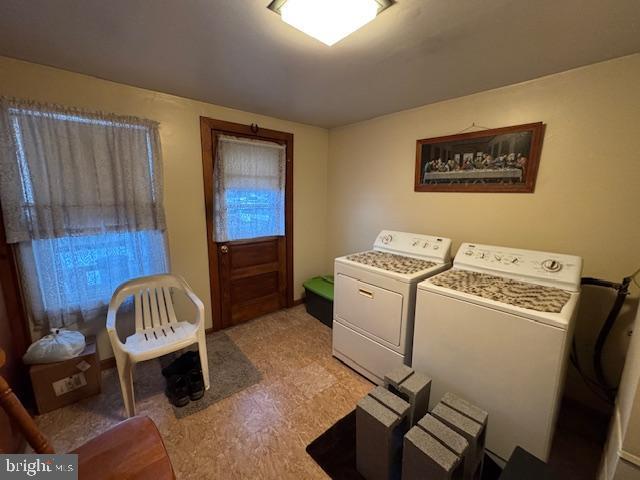 laundry room featuring separate washer and dryer