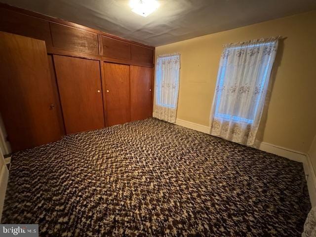 unfurnished bedroom featuring a closet