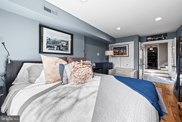 bedroom with hardwood / wood-style flooring