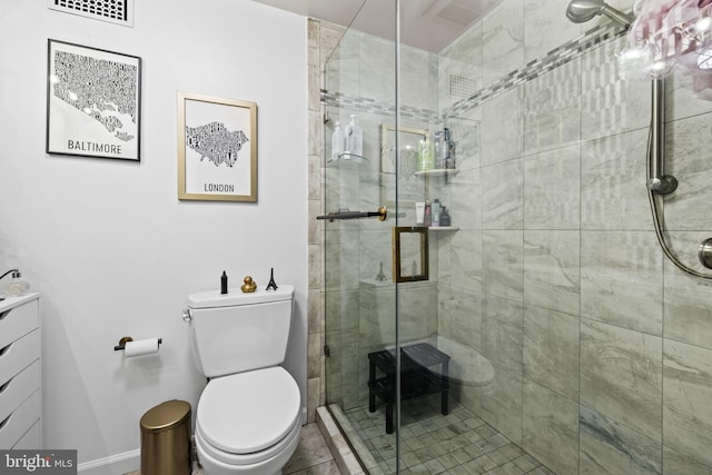 bathroom featuring vanity, toilet, and a shower with door