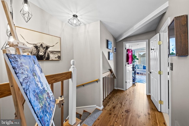 foyer with lofted ceiling and light hardwood / wood-style flooring