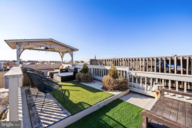 view of yard with a wooden deck and outdoor lounge area