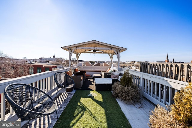 dock area featuring a gazebo, a yard, outdoor lounge area, and a wooden deck