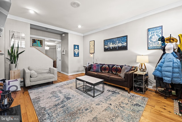 living room featuring crown molding and wood-type flooring