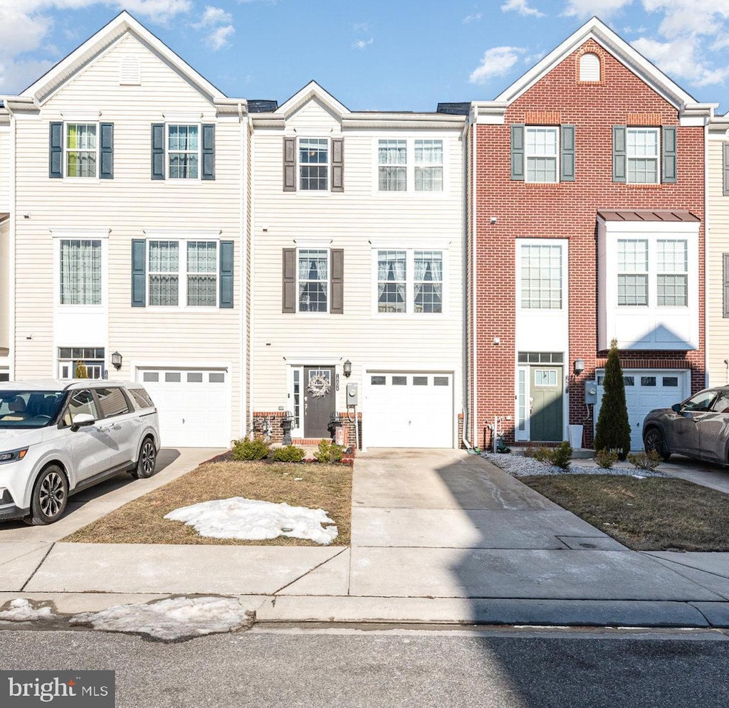 multi unit property featuring a garage