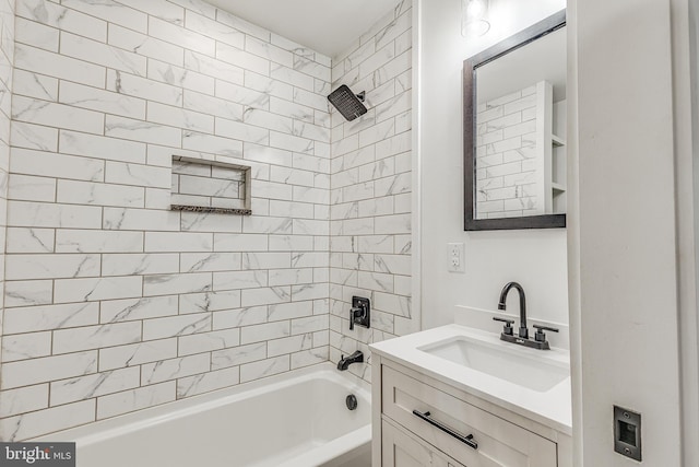 bathroom with vanity and tiled shower / bath combo