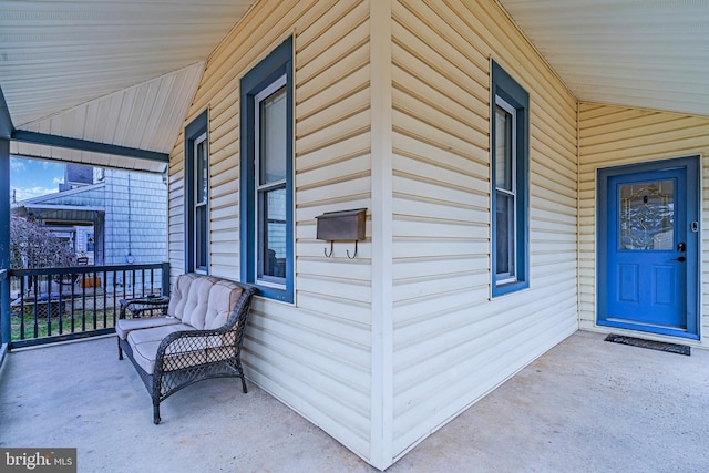 doorway to property featuring a porch