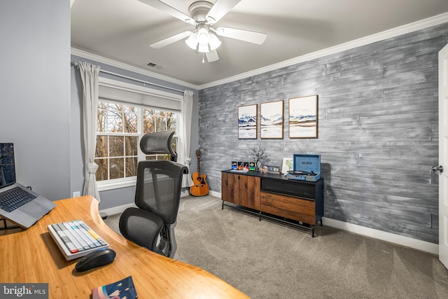 carpeted office with ornamental molding and ceiling fan